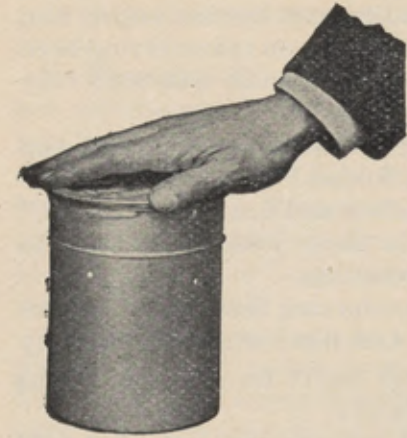 Hand tightening the lid on the solution cup.